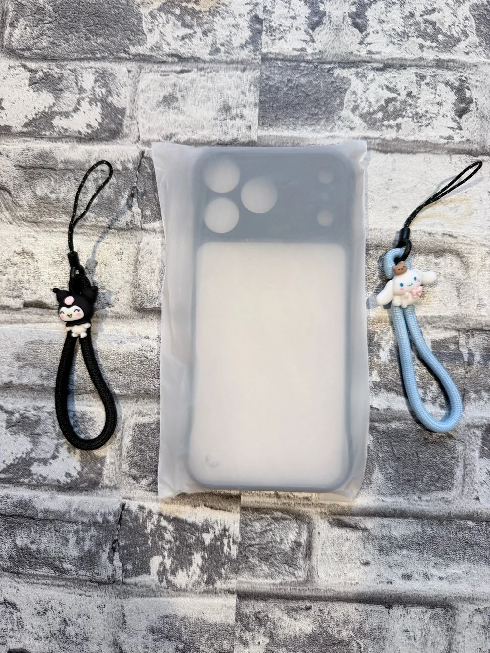17 Pro Max Phone Case Matte Black featuring Kuromi and Cinnamoroll lanyards.